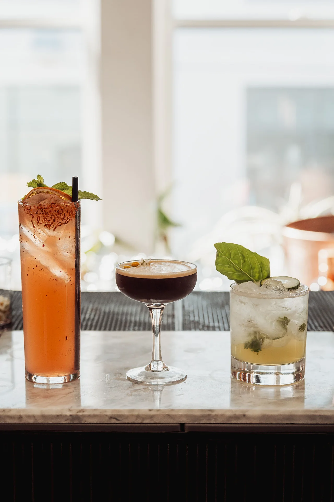 Assortment of garnished cocktails on the bar at GrowthX Launch Party