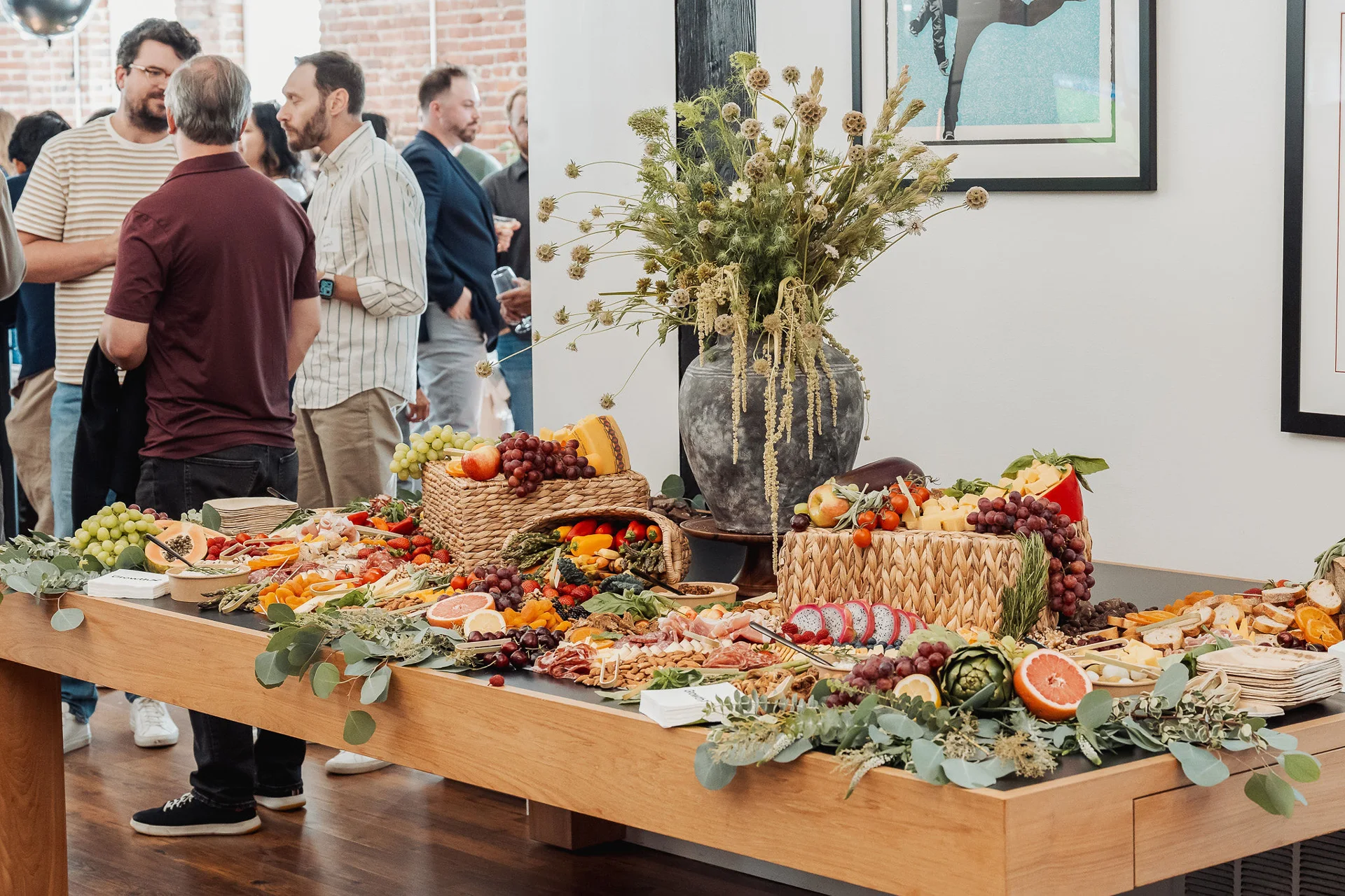 Guests gathering around the grazing table at GrowthX Launch Party