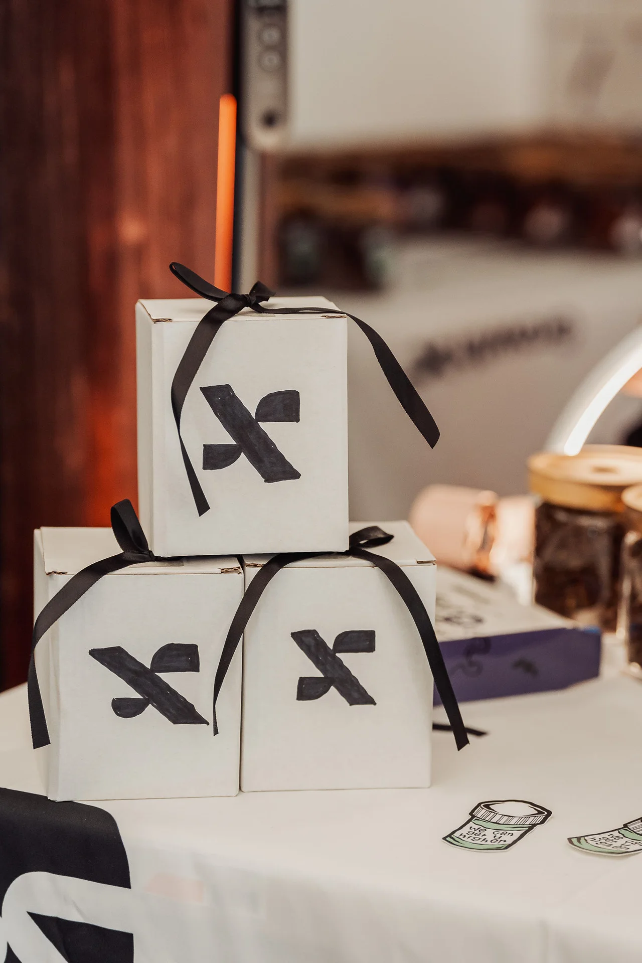 Stacked GrowthX branded favor boxes at GrowthX Launch Party