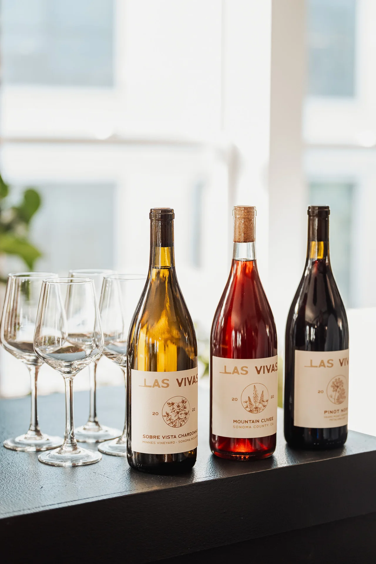 Wine bottles and stemware on the bar at GrowthX Launch Party
