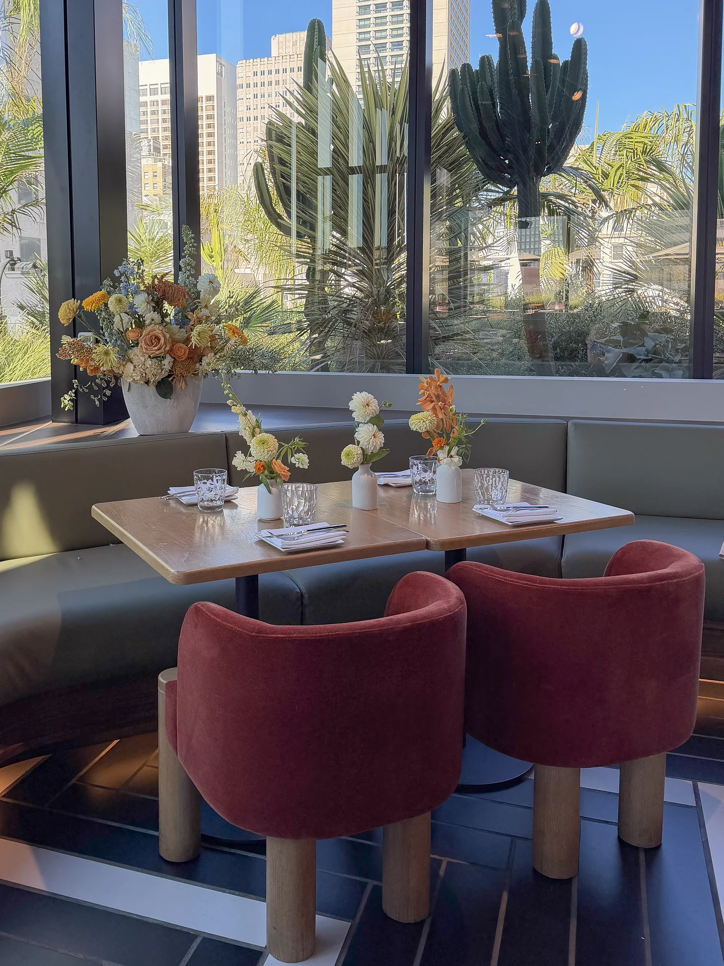 Baby shower tables beside garden windows at Bloom Baby Shower