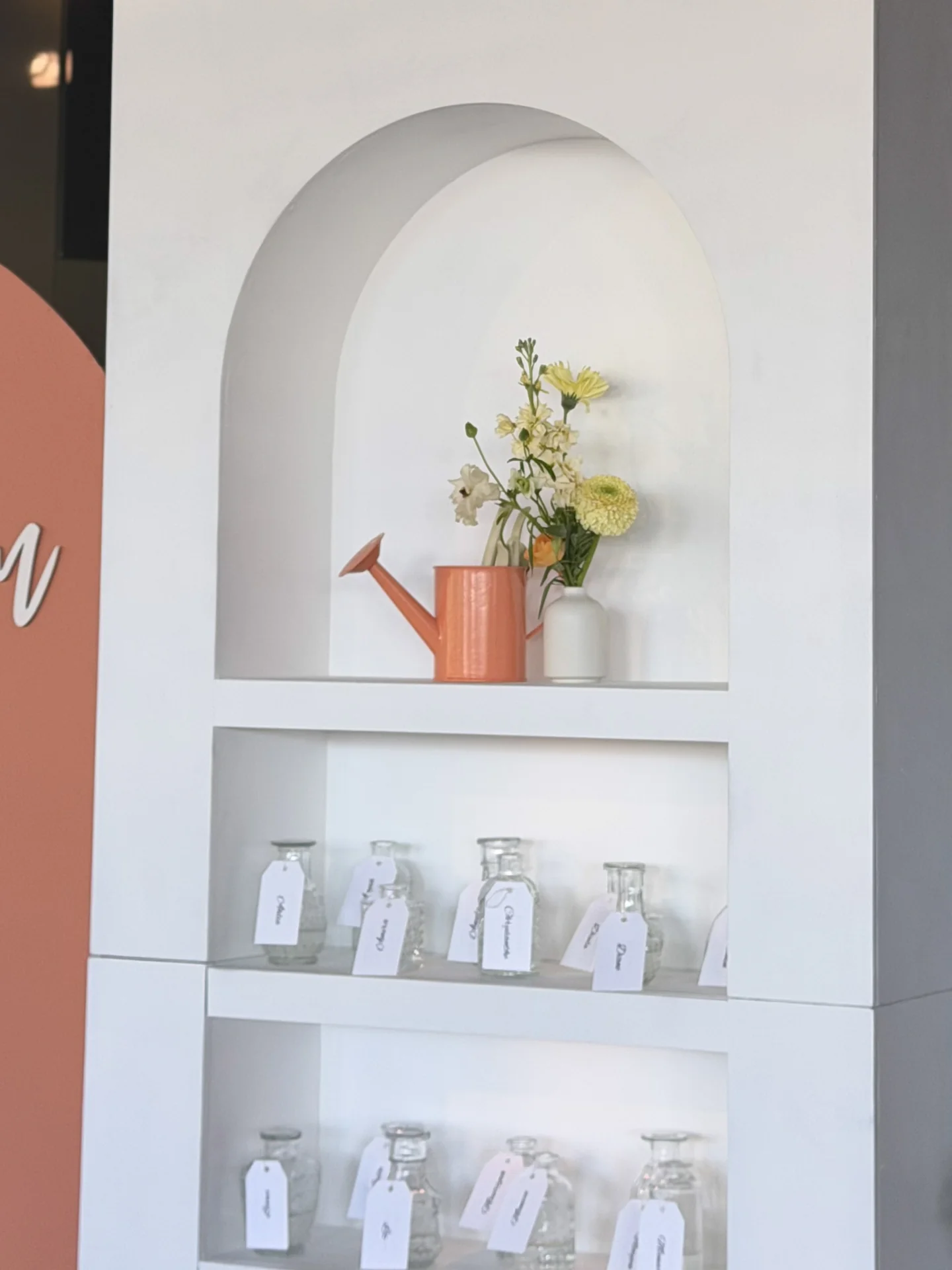Baby shower favors on decorative shelves at Bloom Baby Shower