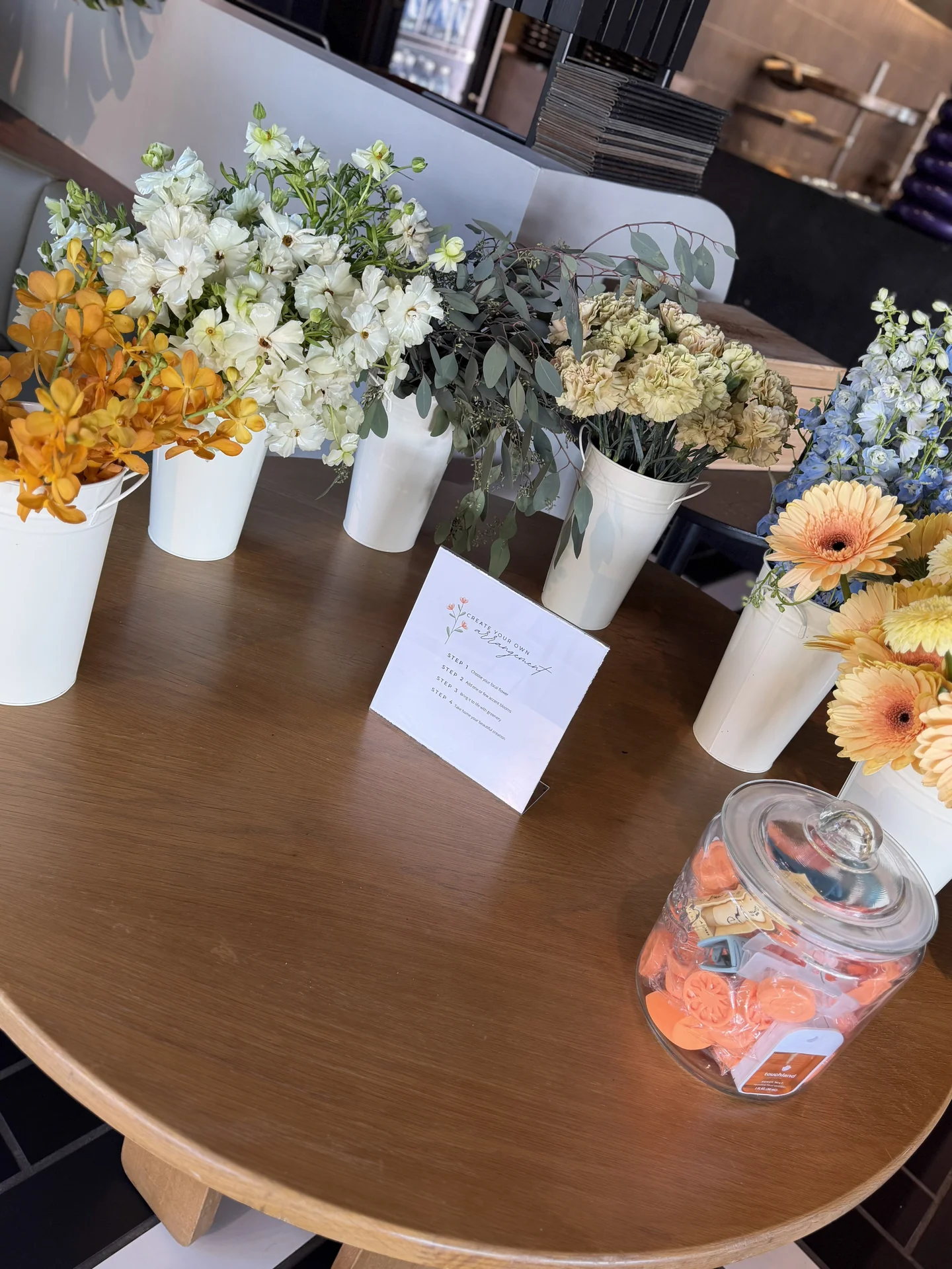 Dining table with shower stationery and flowers at Bloom Baby Shower