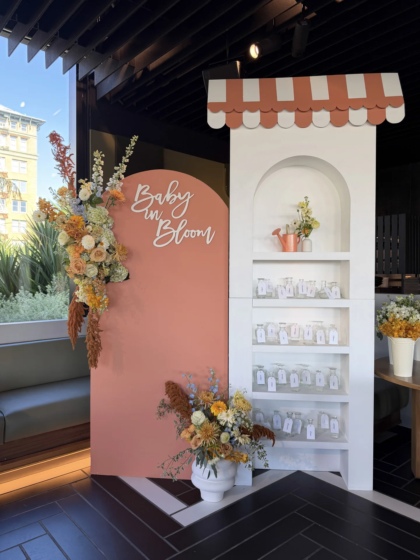 Pink floral welcome installation at Bloom Baby Shower