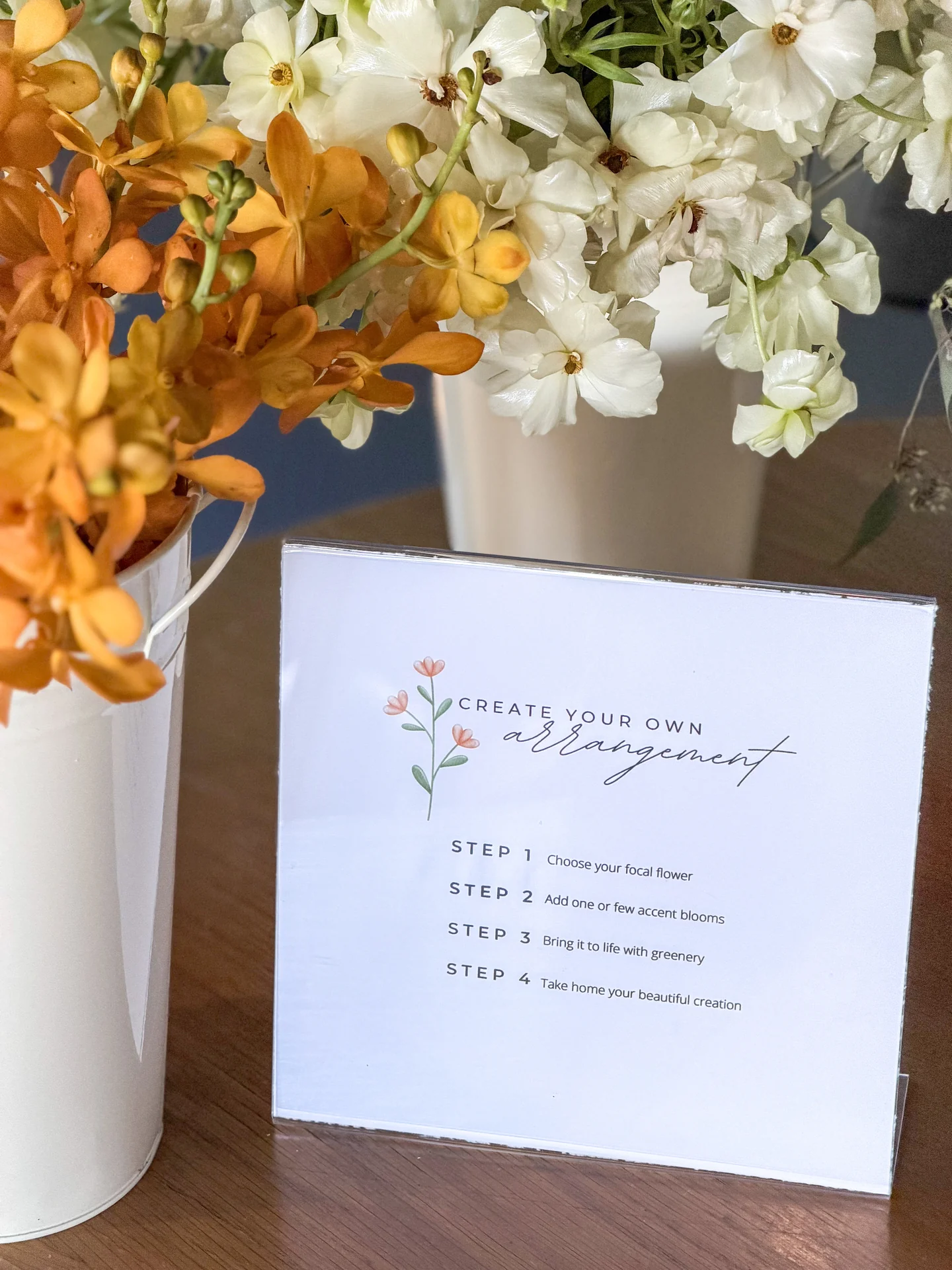 Baby shower stationery beside flowers at Bloom Baby Shower