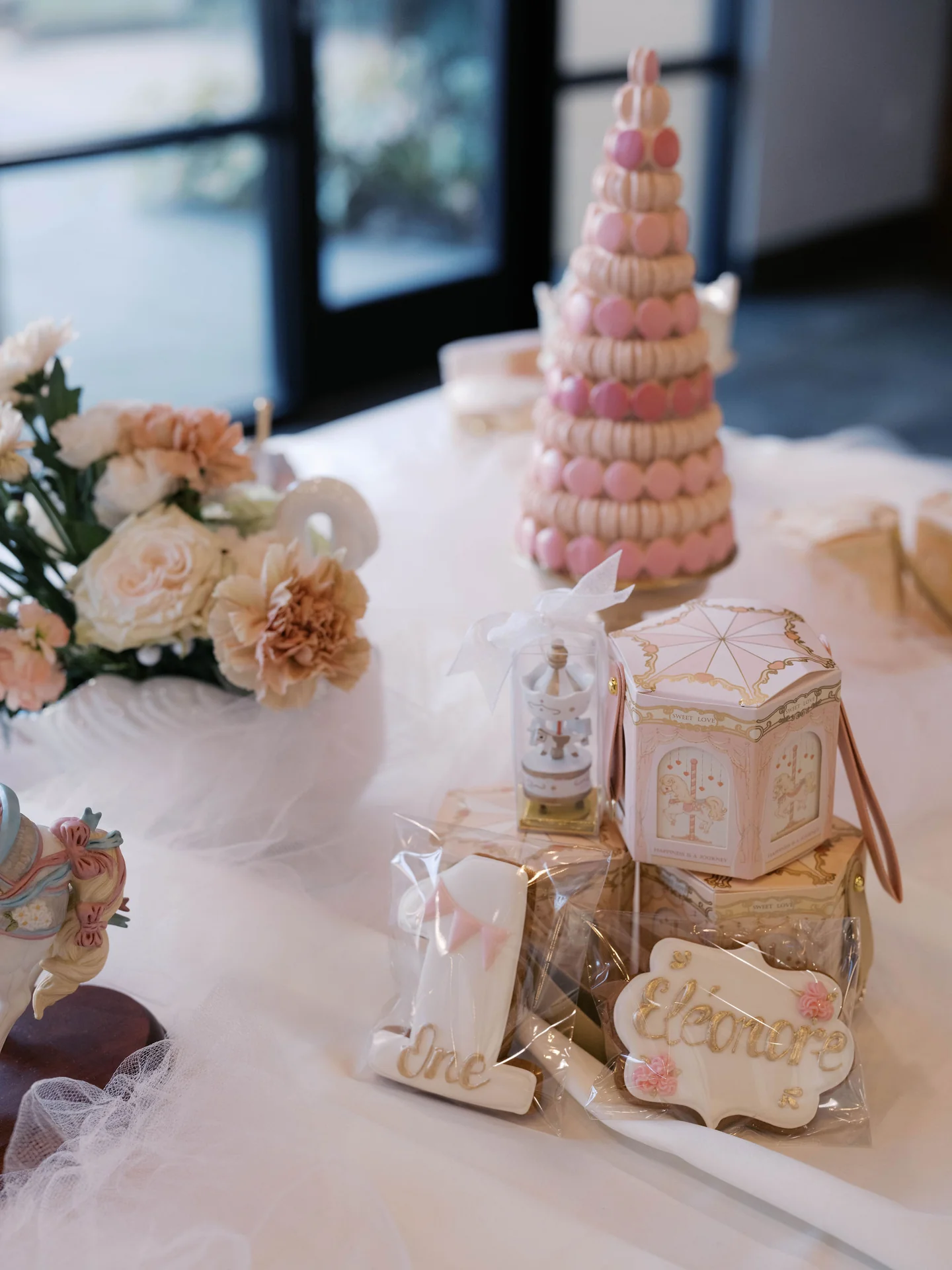 Pink desserts on the birthday table at Eléonore First Birthday