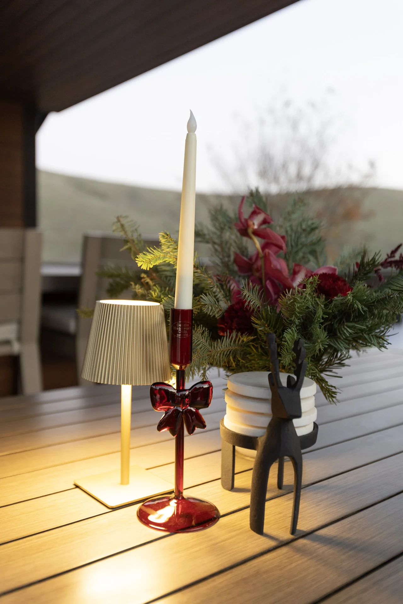 Holiday floral arrangement beside a window at M&E Company Holiday Party