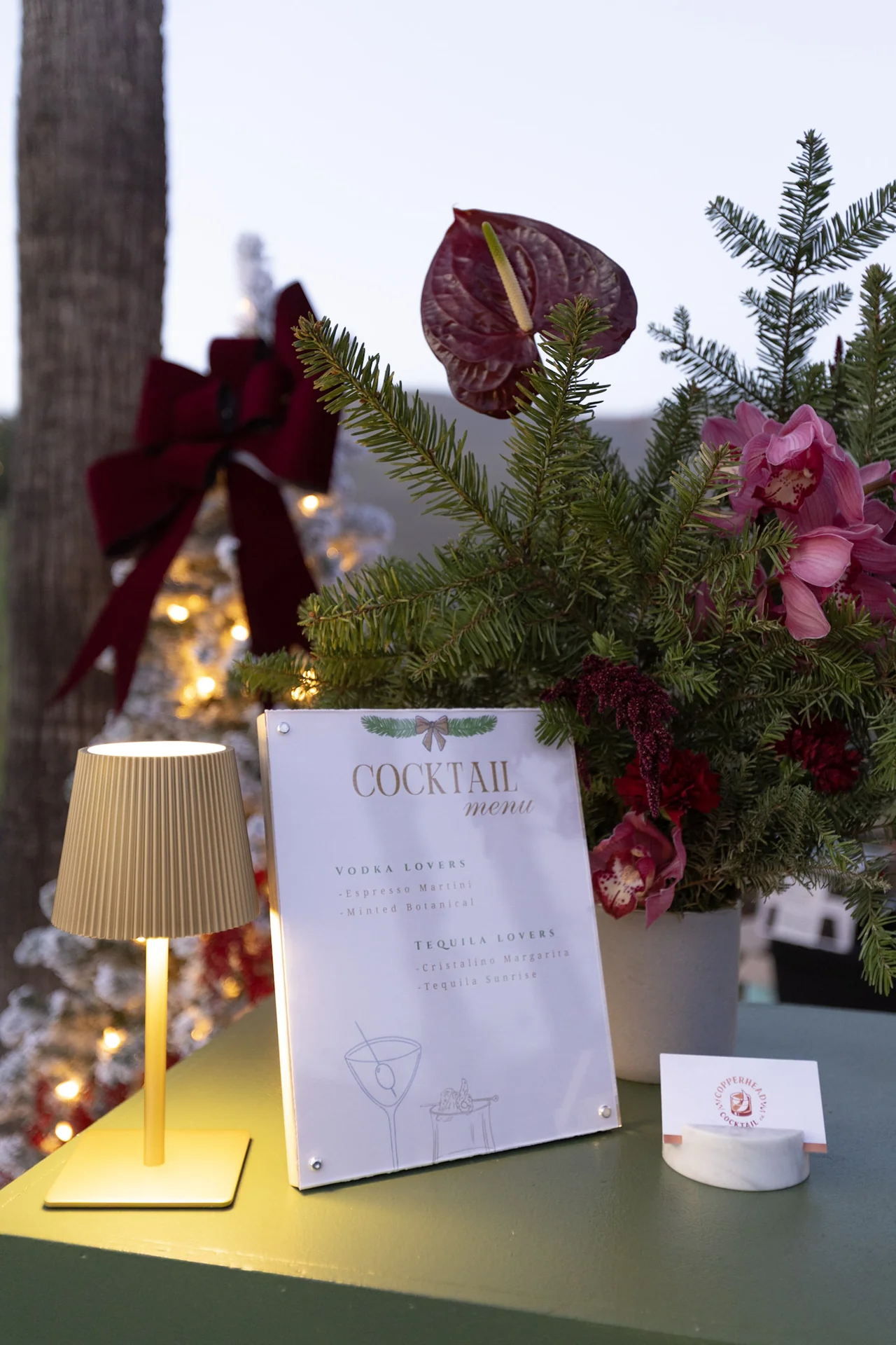 Festive flowers and event signage at M&E Company Holiday Party