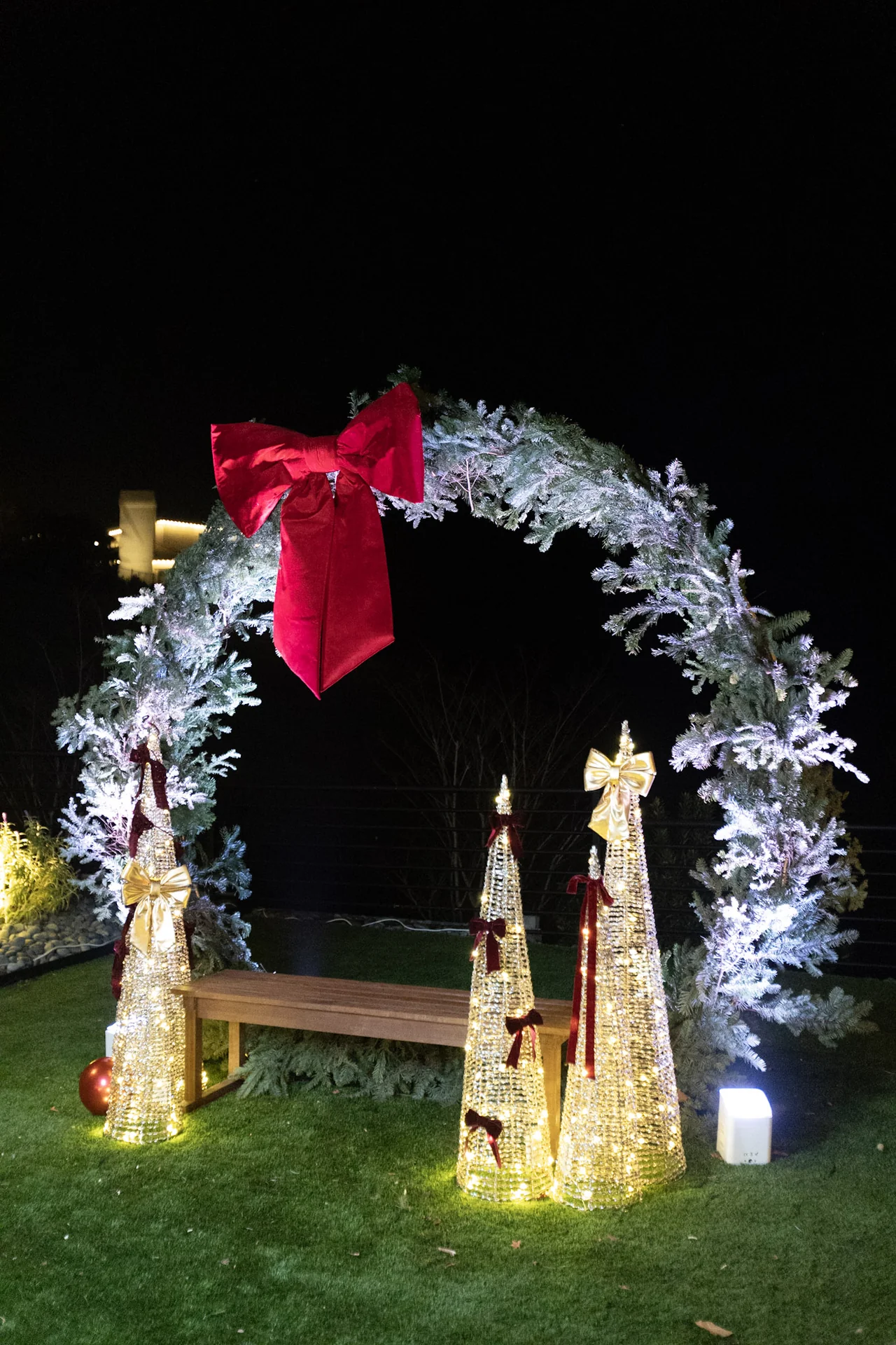 Illuminated holiday wreath at night at M&E Company Holiday Party